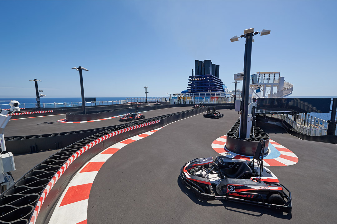  Hop into the driver’s seat and race for first place at <em>Norwegian Joy’s</em> exciting racetrack on Deck 19!  