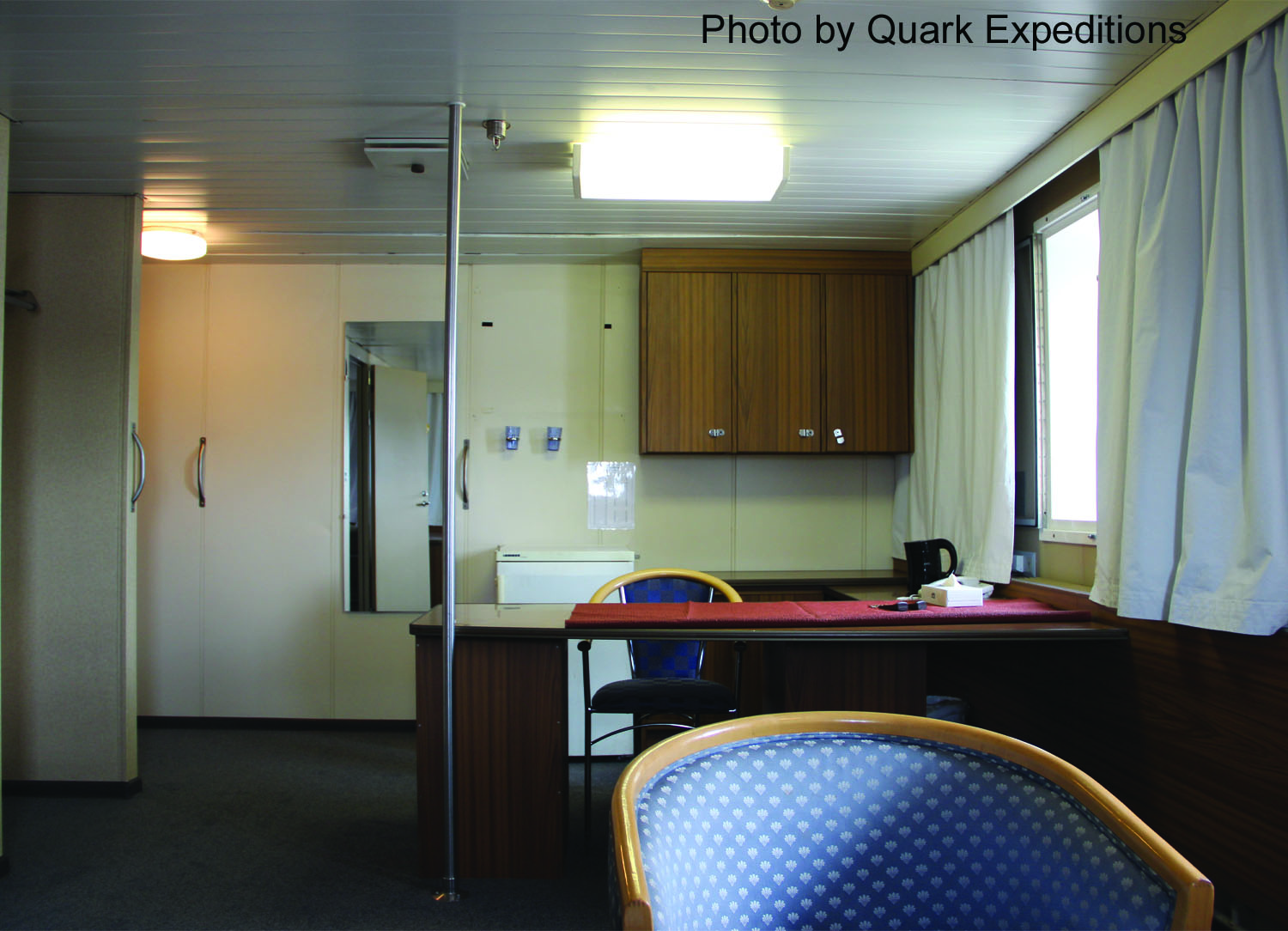 Living room in the Corner Suite aboard <em>Kapitan Khlebnikov</em>. 