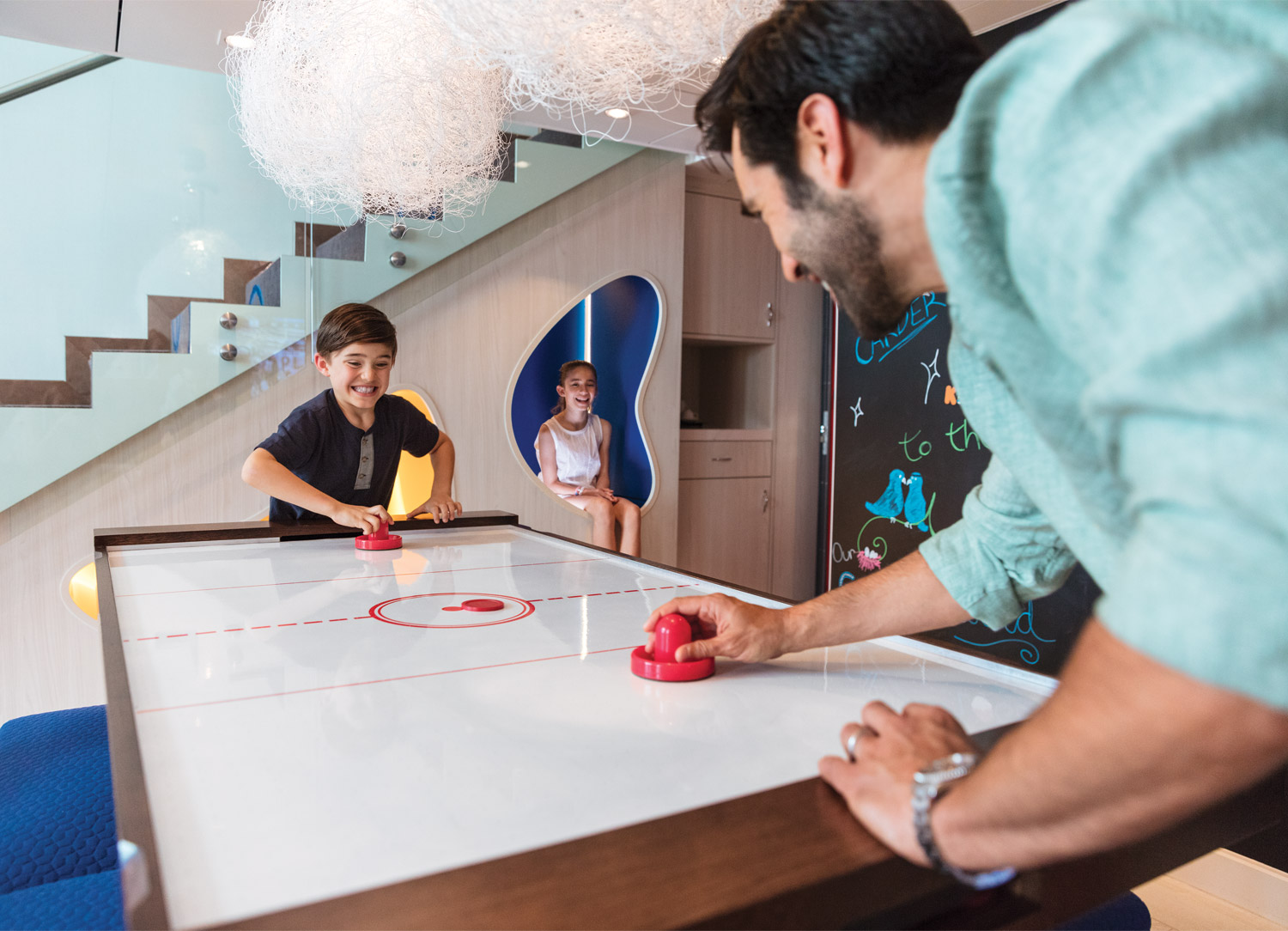  The Ultimate Family Suite, exclusively onboard <em>Symphony of the Seas</em>, features air-hockey, hidden nooks, a chalk wall, and many more delightful surprises!  
