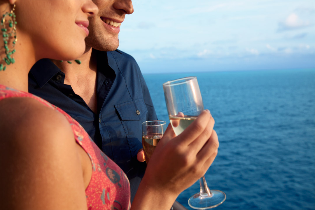  Couples will enjoy the many complimentary, late-night offerings onboard <em>Freedom of the Seas</em>, such as no-cover bars, free shows, and pool deck. 