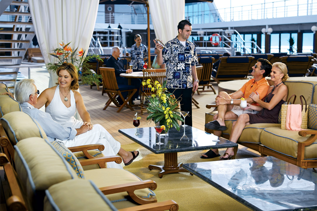  Relaxing on the Pool Deck is a great way to spend time while onboard <em>Nautica</em>. 