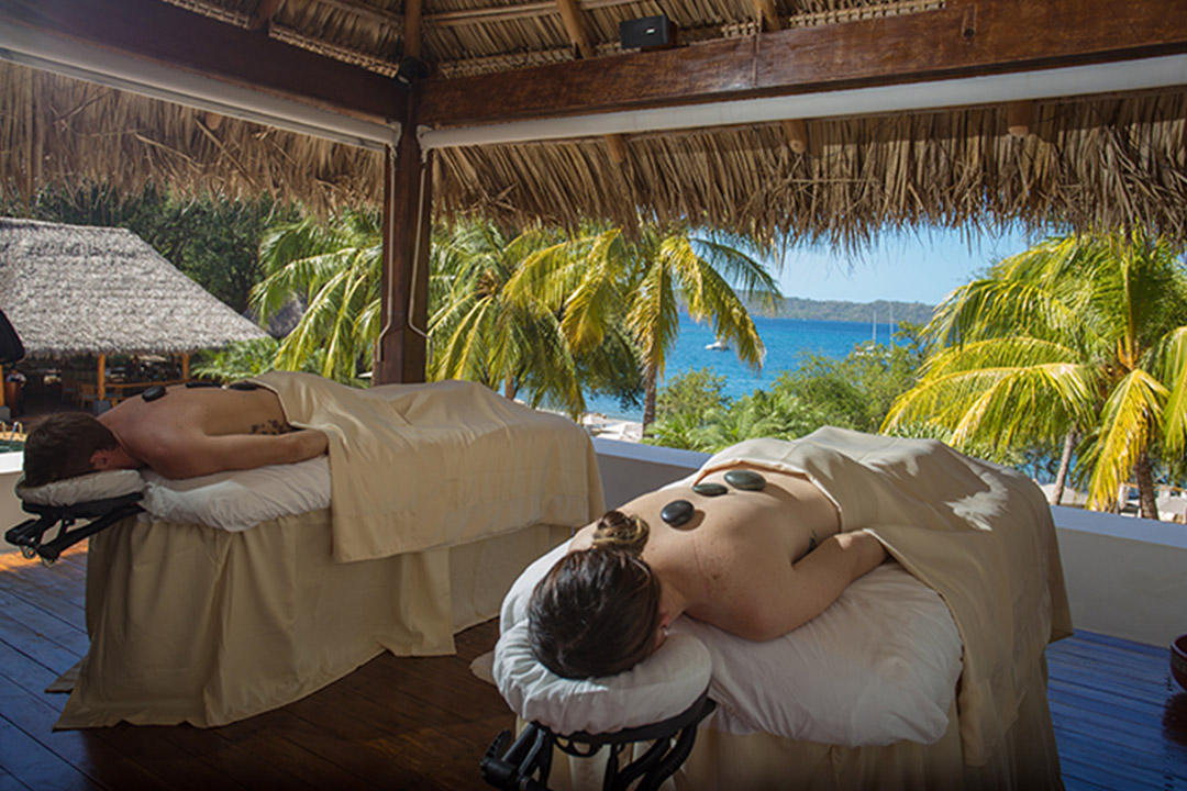 Enjoy a relaxing treatment at the luxurious spa at Secrets Resorts. Pictured here is a couples massage at Secrets Papagayo Costa Rica.