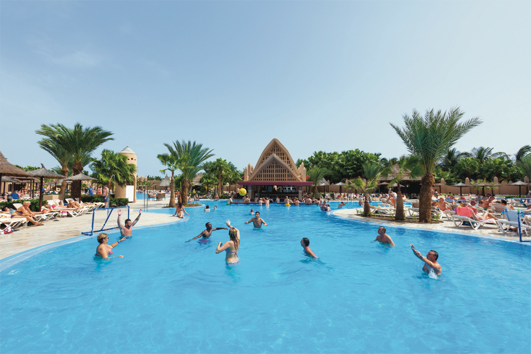 Have fun at one of the swimming pools, equipped with a swim-up bar, at Hotel Riu Funana.