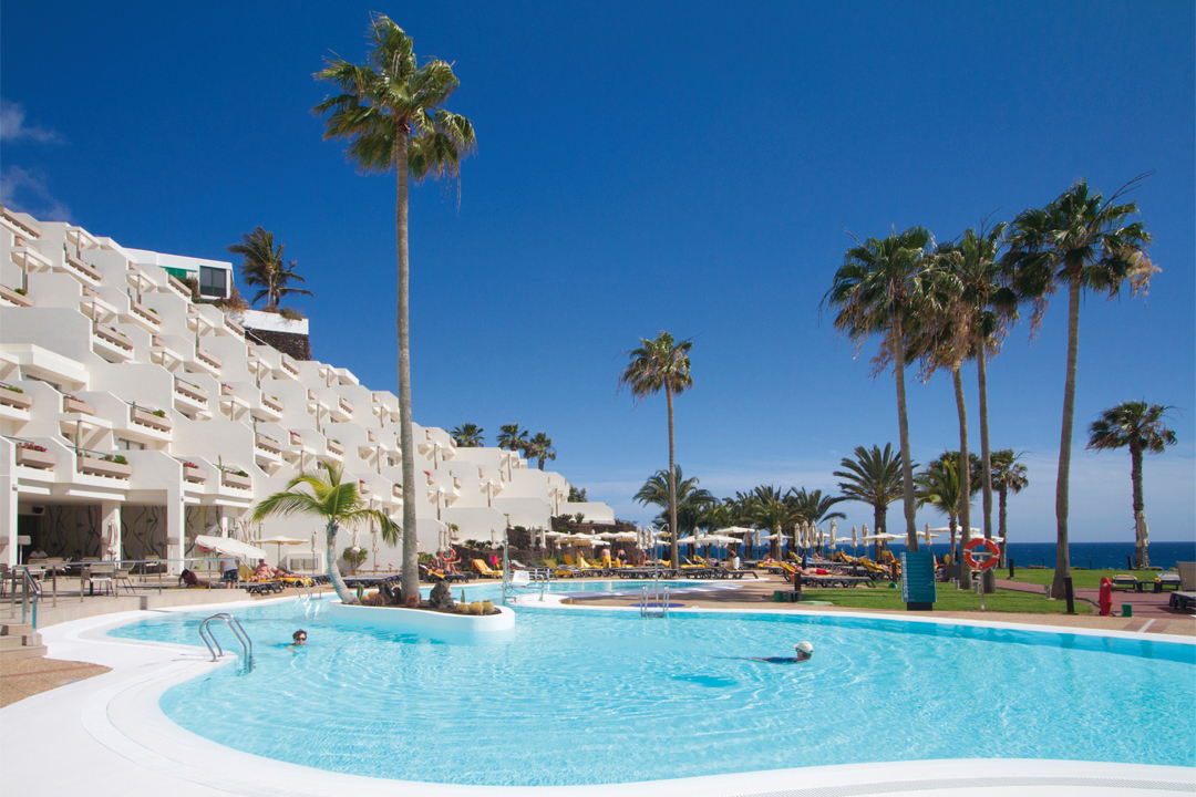 Go for a swim in the refreshing swimming pool at Hotel Riu Calypso.